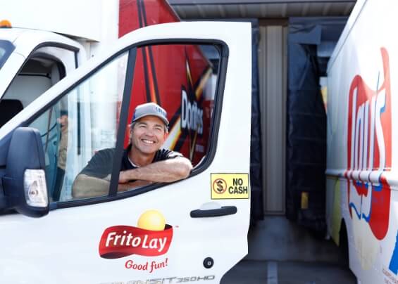 Smiling man in his FritoLay truck